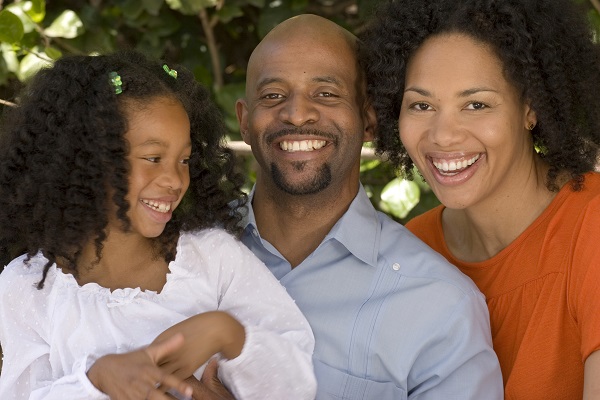 Parents sitting with child