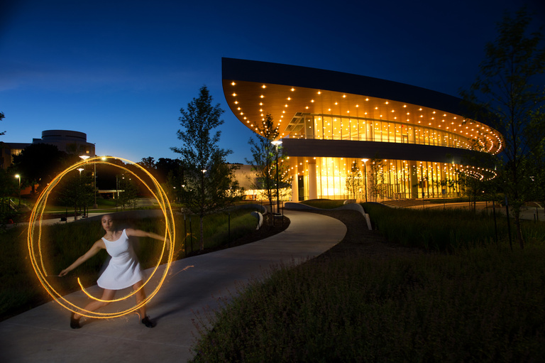 Hancher at night with dancer