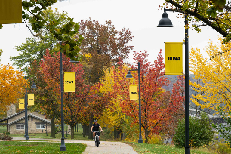 Biking on a trail near campus in the fall