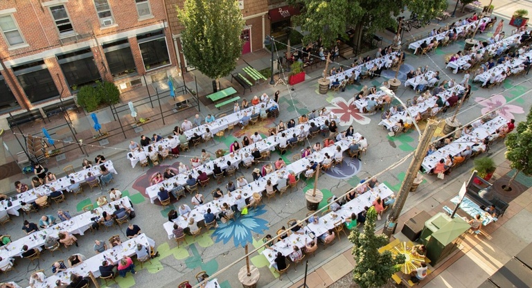 Photo of people eating dinner on the Northside of Iowa City